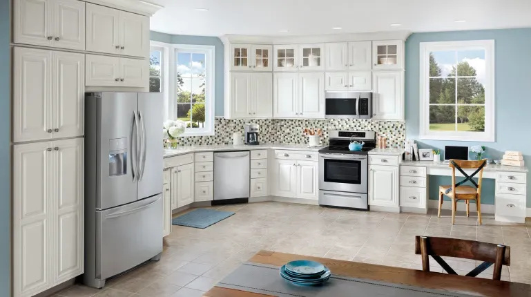 Kitchen with sky blue walls and white cabinets